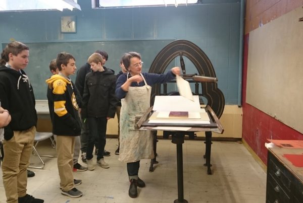 Fine Art Printer Mary Rhinelander showing O'Maley students how to pull a print off the #AcornPress. Photo Credit: Brett Dunton, O'Maley School Art Teacher